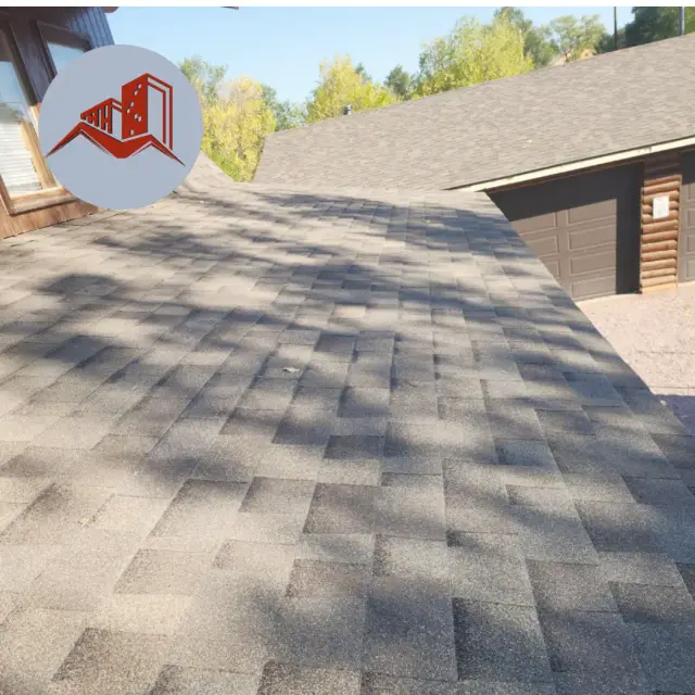 Overhead view of an architectural asphalt shingle roof in warm brown tones on a residential home
